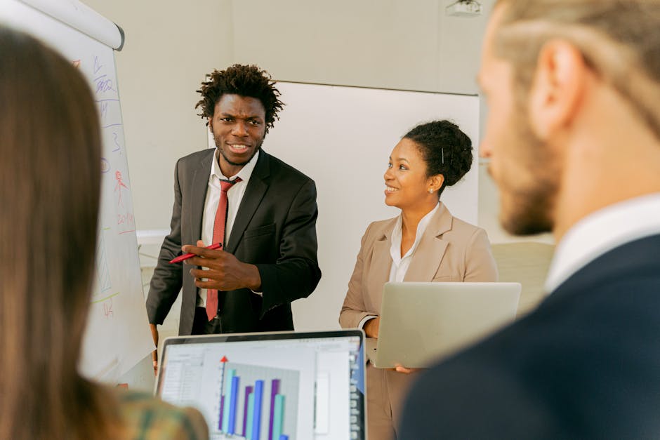 Diverse business team discussing strategies and ideas in a professional office setting